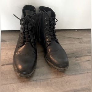 Black, vegan leather ankle boots. Laces in front but zips up on the side
